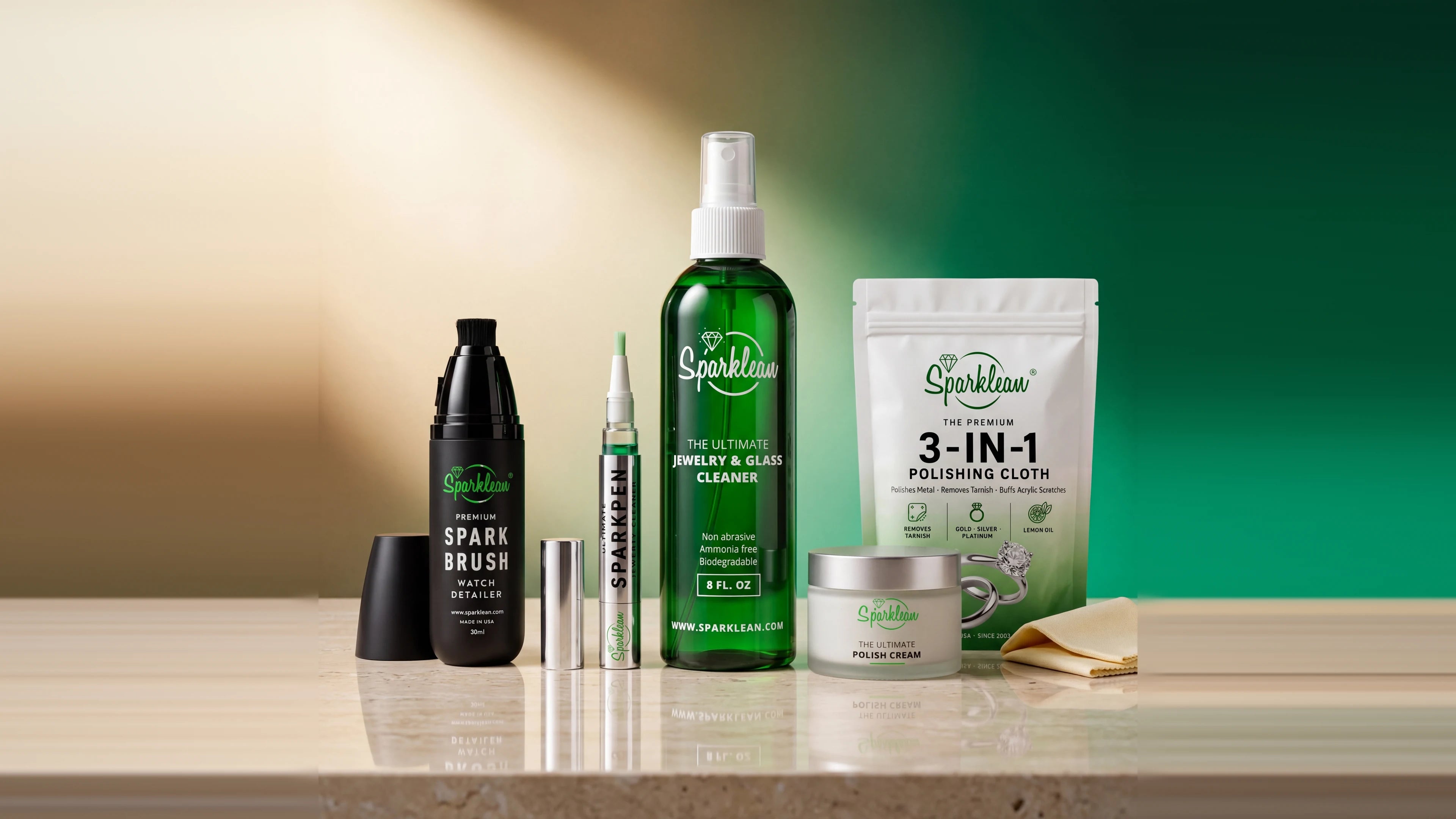 Sparklean complete jewelry care system - SparkBrush, Sparkpen, Jewelry & Glass Cleaner spray, Polish Cream, and 3-in-1 Polishing Cloth on marble counter